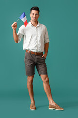 Poster - Handsome young man with flag of France on green background