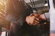 © alphaspirit - Handshaking of business person in office as teamwork and partnership