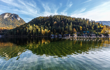 Fototapete - Scenic image of Fairy tale lake in Alps. Breathtaking Scene. Amazing nature landscape with calm lake, autumn forest and rock mount under sunlit. Altaussee lake