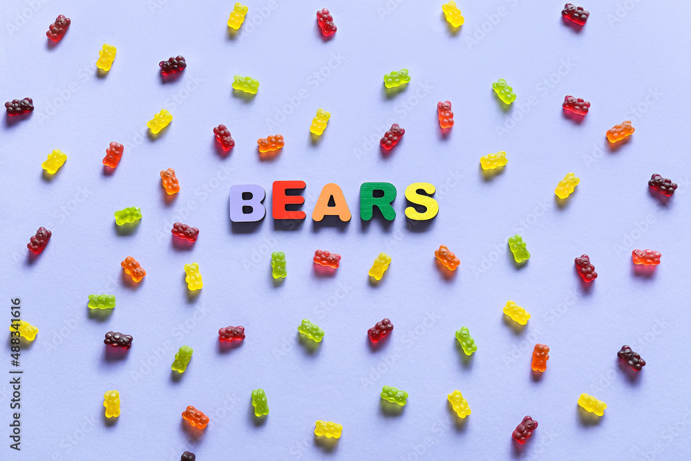 Composition with sweet jelly bears on blue background