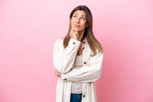Middle Age Caucasian Woman Isolated On Pink Background Thinking An Idea While Looking Up