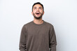 © luismolinero - Young Brazilian man isolated on white background looking up and with surprised expression