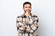 © luismolinero - Young Brazilian man isolated on white background thinking an idea while looking up