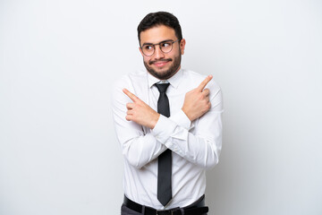 Wall Mural - Business Brazilian man isolated on white background pointing to the laterals having doubts