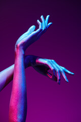 hands in neon light