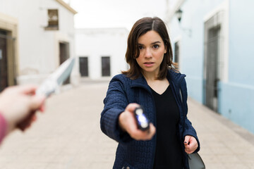 Wall Mural - Fearless victim using a taser