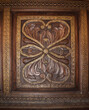 Antique wooden furniture with carvings and inlaid metal