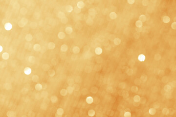 Gold light shiny bokeh abstract blur background with bright round defocus golden pattern