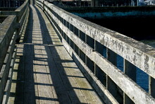Wooden Bridge To Wave Breaker In Westhaven Cove