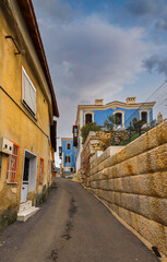 Wall Mural - Turkey Milas houses built in the 19th century . The entrance to the two-storey houses with courtyards is from the courtyard. The wooden-supported overhangs of the houses overflow into the street.