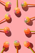 Colorful Set of Lollipops. pattern made with caramel on a stick on bright pink background.  creative pattern.  lot of lollipops chupa chups...