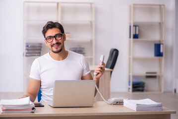 Young male student employee at workplace