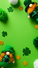 St Patricks Day Vertical Background With Leprechauns, Shamrock Clover Leaves, Gold Coins, Decorations. Flat Lay, Top View, Copy Space.