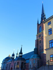 Wall Mural - Stockholm. Sweden. Riddarholmen Church, located on Riddarholmen Island, next to the Royal Palace in Stockholm, Sweden. The only surviving medieval monastery church in Stockholm.