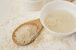 white bowls with rice and rice water, fermented skin and hair care products, organic cosmetics, light background