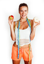 Woman Measuring Waist With Tape Having Choise Between Apple And Donut Isolated On White Background