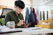 Start up small business entrepreneur  checking online order or updating the shipment status on digital tablet.