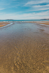 Wall Mural - beautiful scenary of the Brown River estuary meeting the Pacific Ocean and golden sand of Kingston Beach in Southern Tasmania