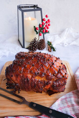 Delicious homemade festive food meal. Roasted Honey Glazed Ham with Festive Decorations. Great feast for Christmas party with family members.