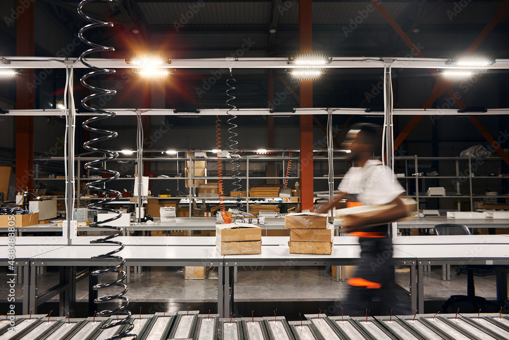 African factory worker delivering box at the storage Stock Photo ...