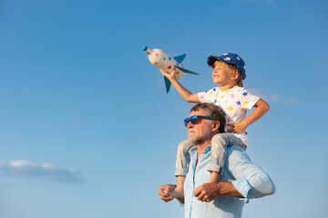 Grandfather and boy having fun outdoor