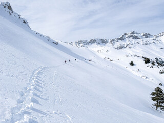 Wall Mural - horizontal crossings of a professional mountaineer team through a dangerous area