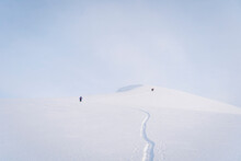 Hikers Hiking On Snowcapped Mountain At Sheregesh, Russia