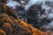 Small Waterfall In North Caucasus On Foggy Autumn Day