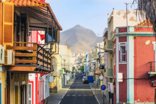 Cape Verde, Sao Vicente, Mindelo, Empty City Street With House Balcony In Foreground And Mountain In Background