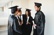 © Serhii - education, graduation and people concept - group of happy international students.