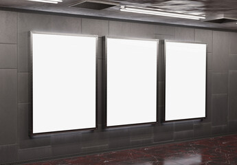 Wall Mural - Three blank billboards on underground subway wall Mockup. Hoardings advertising triptych on train station interior 3D rendering