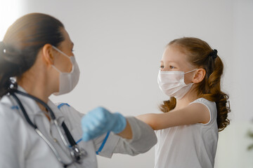 Wall Mural - Doctor and child wearing facemasks