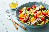 Fototapeta  - Fresh colorful spring vegetable salad in the blue bowl - healthy organic vegan lunch.