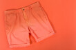 © aneduard - orange men's shorts, on an orange background, concept