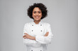 © Syda Productions - cooking, culinary and people concept - happy smiling female chef in white jacket over grey background