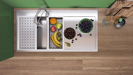 Wall Mural - Modern green and wooden kitchen, sink with running tap and healthy fruit. Vase with spikes, wooden cutting boards. Top view, plan, above with copy space, interior design idea