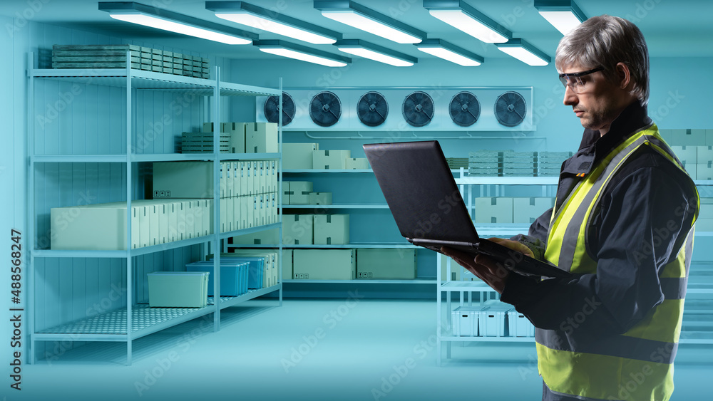 Using Computer In Cold Store Photo Stock Engineer in cold store. Concept of installation of ...