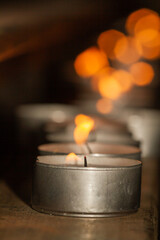 Wall Mural - Candle lit on wood during holy week in Seville, concept of religion, selective approach.