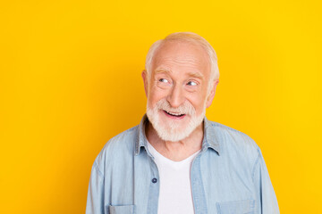 Poster - Portrait of attractive bewildered cheerful grey-haired man creating solution copy space isolated over bright yellow color background