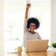 Poster - Success is hers for the taking. Portrait of a young woman doing a fist pump while working on her laptop at home.