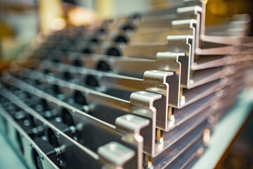 Modern metal parts of TFT displays on a table in a workshop