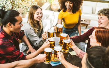  Multiracial friends having rooftop party - Young people cheering beer glasses together in brewery bar restaurant - Dining lifestyle and youth culture concept