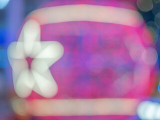 Wall Mural - Abstract blurry red and pink bokeh, glitter and white star shape for pattern, texture and background