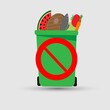 Foodstuff in a garbage bin with the stop sign on it. Reduce food waste concept