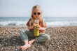 © EVERST - Child drinking smoothie on beach healthy lifestyle vegan breakfast organic food summer vacations