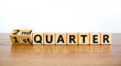 From 1st first to 2nd second quarter symbol. Turned wooden cubes and changed words 1st quarter to 2nd quarter. Beautiful wooden table white background. Business happy 2nd quarter concept. Copy space.