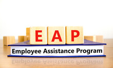 EAP Employee Assistance Program Symbol. Concept Words EAP Employee Assistance Program On Cubes On Book On A Beautiful White Background. Business EAP Employee Assistance Program Concept. Copy Space.