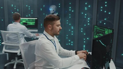 Wall Mural - data center. modern it specialist bearded guy programming software security code and cooperating wit