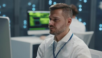 Wall Mural - handsome bearded it specialist working in digital office, using desktop computer programming softwar