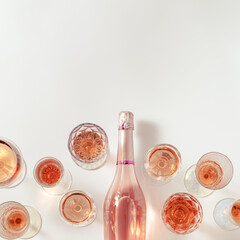 Wall Mural - Rose wine assortment in crystal glasses, bottle of rose champagne sparkling wine. Summer alcoholic drink